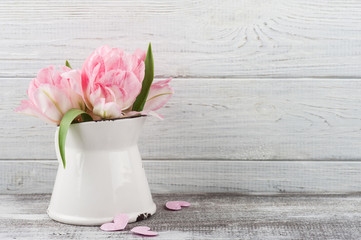 Fresh pink tulip flowers in jug