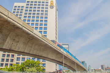Sky train bridge structure with beam and girder under blue sky background. Railway and tollway in the city with blue sky background. Public area in Bangkok, Thailand.