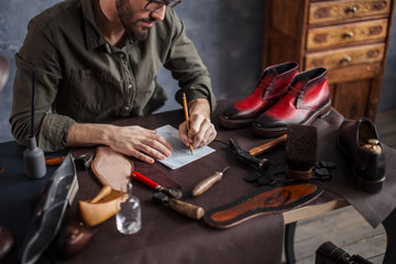 craftman planning the working day. close up cropped photo