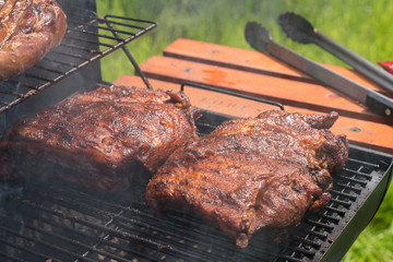 Grilled pork ribs on the grill. Summer outdoor