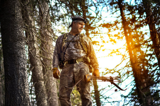 Low angle view of man dressed in khaki clothes holding - Powered by Adobe