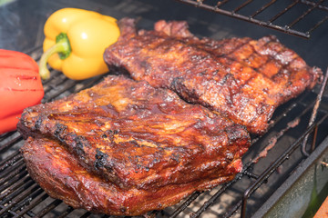 Grilled pork ribs on the grill. Summer outdoor
