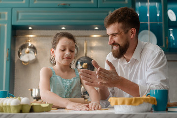 Daddy and daughter making cookies