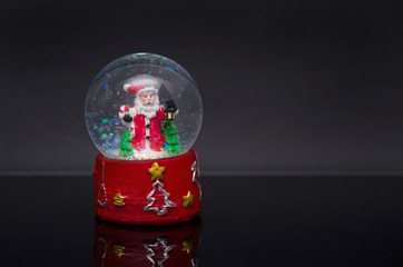 Santa in a snow globe