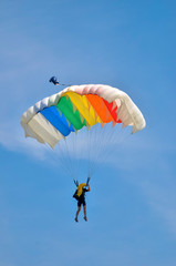 parachute in the sky with colorful flag