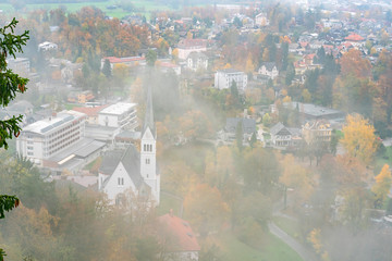 Aerial foggy view of the town center of Lake Bled