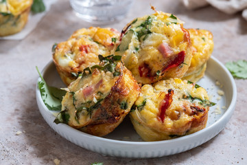 Delicious egg muffins with ham, cheese and vegetables