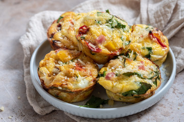 Delicious egg muffins with ham, cheese and vegetables