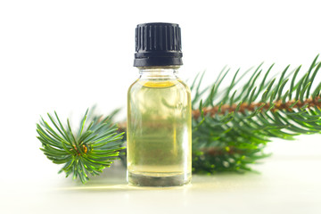 Essence of pine on table in beautiful glass jar