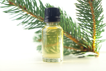 Essence of pine on table in beautiful glass jar