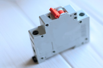 wooden background. on it in a row are automatic switches for opening the electric circuit.