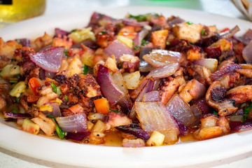 Fried Octopus Ceviche traditional Mexican Dish on White plate. 