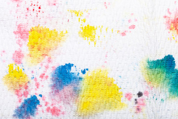 An abstract pattern created from paint daubs on a paper kitchen towel