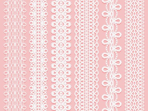 Wide lace ribbons set on a pink background.