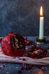Pomegranate on Table with Candle