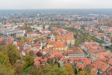 Naklejka na ściany i meble Aerial view of the Church of St. James and Ljubliana cityscape