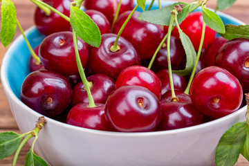 White plate of ripe cherries