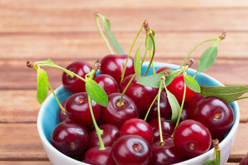 White plate of ripe cherries