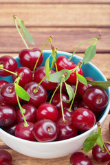 White plate of ripe cherries
