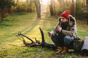 Young blogger photographer travel in mountain forest