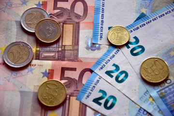 Euros money in banknotes and coins