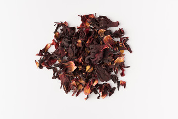 petals of dry hibiscus tea isolated on white background, top view