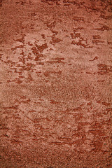 old textured wall with decorative plaster. stylized bronze, copper, metal.