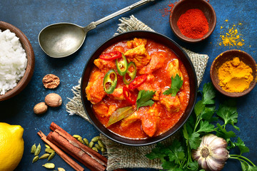 Chicken tikka masala - traditional dish of indian cuisine.Top view with copy space.