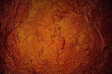 old textured wall with decorative plaster. stylized bronze, copper, metal.