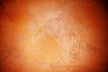 old textured wall with decorative plaster. stylized bronze, copper, metal.