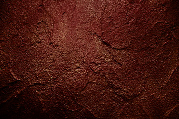old textured wall with decorative plaster. stylized bronze, copper, metal.