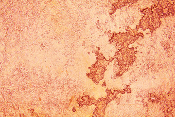 old textured wall with decorative plaster. stylized bronze, copper, metal.