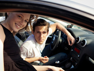 Portrait of friends sitting in car 