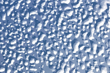 Icy drops of water in the rays of the sun