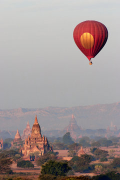 Hot air balloon over temple 