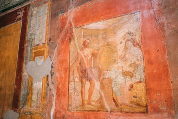 Pompeii, Italy. Ancient Frescoes In Wall Of Old Building