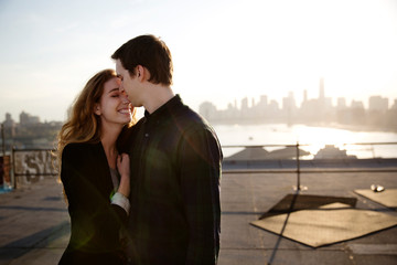 Embracing couple on sunny day 