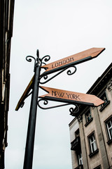 Urban London New York Signpost Shows Travel Tourism And Destinations