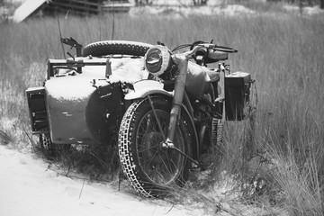 Fototapeta na wymiar Old Tricar, Three-Wheeled Motorbike Of Wehrmacht, Armed Forces Of Germany Of World War II Time In Winter Forest