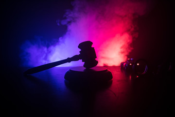 Legal law concept. Silhouette of handcuffs with The Statue of Justice on backside with the flashing...