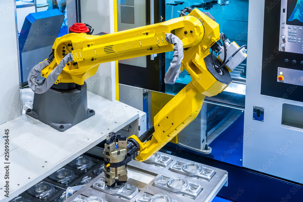 Poster the robot arm. manipulator puts the parts in the machine..robotic technology. automation of producti