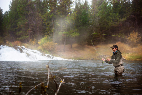 Man fly-fishing in river 