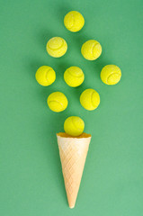 Waffle cone with yellow rubber bands on bright background