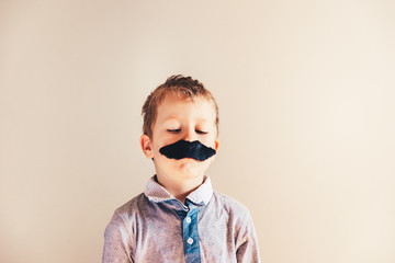 Fototapeta premium Child with mustache isolated on white.