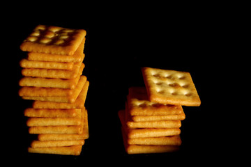 Crackers biscuit background / A cracker is a flat, dry baked food typically made with flour. 