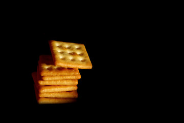 Crackers biscuit background / A cracker is a flat, dry baked food typically made with flour. 