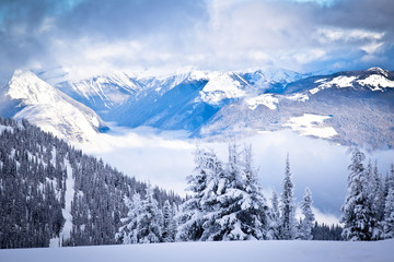 Snowy Mountain with Clouds in the Valley