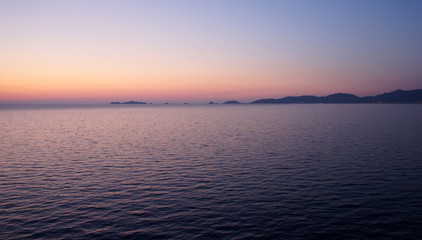 In crimson tones, or arrival to the island of Corsica late spring evening.