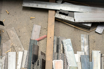 abstract metal and wood pieces to printing press background