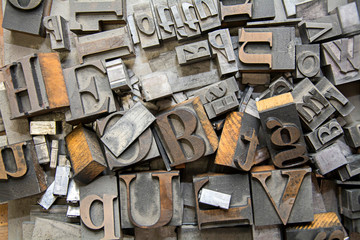 alphabet letter press background with old type lettering